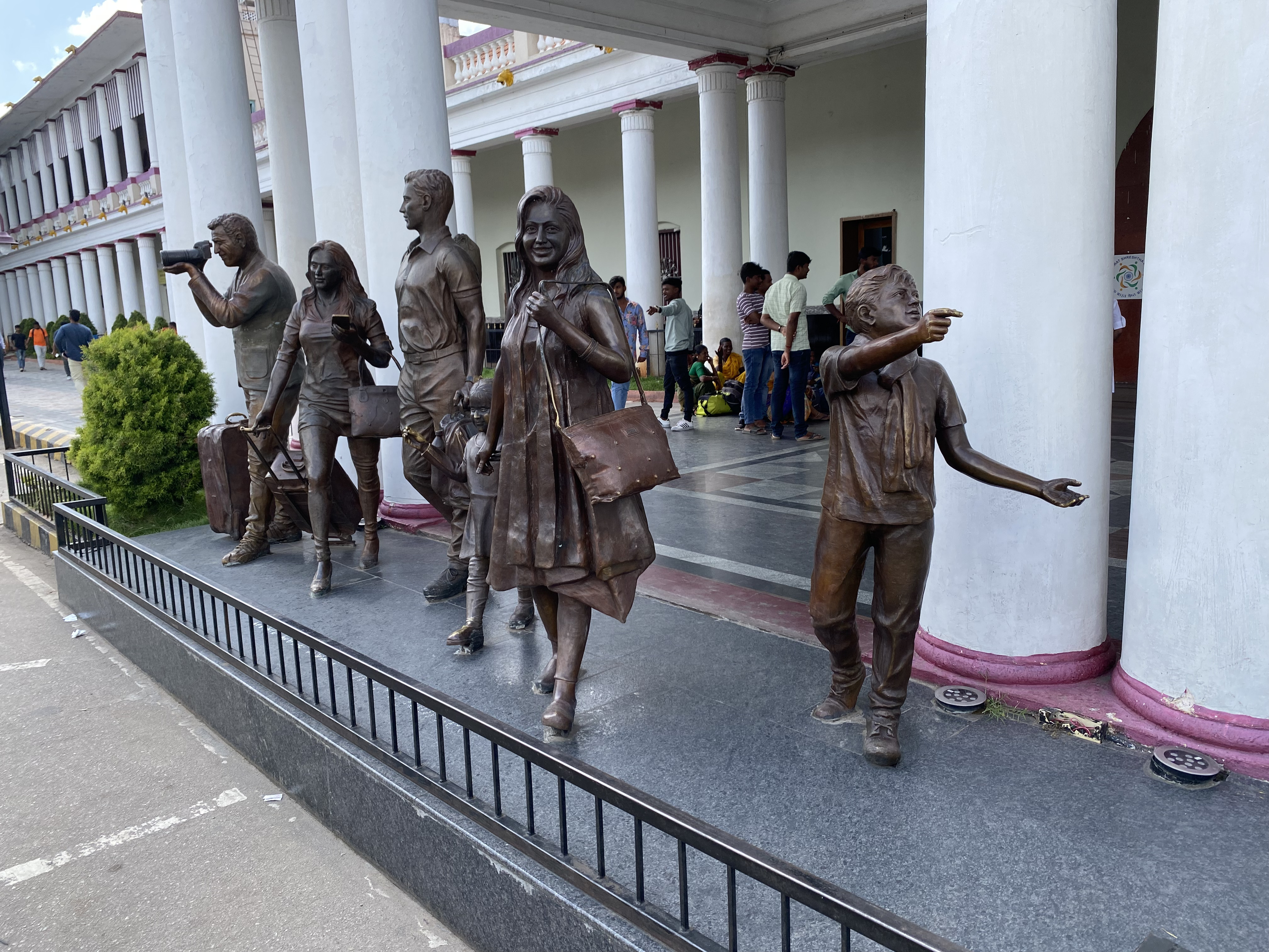 statues in front of the Mysuru Stn East Gate